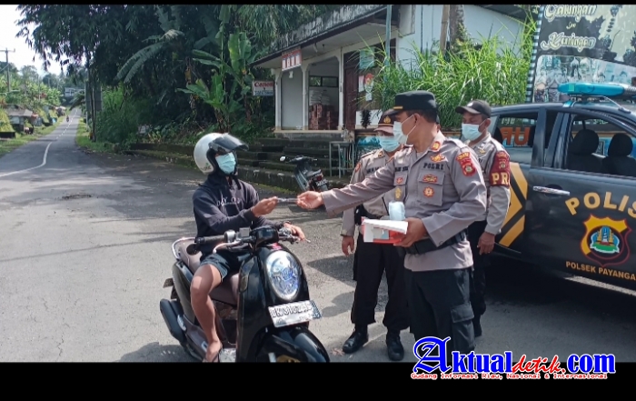 Polres Gianyar Bersama Jajaran Polsek Payangan Gelar Giat Prokes Covid 19 dan Bhakti Sosial